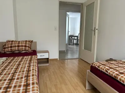 Ein Bett oder Betten in einem Zimmer der Unterkunft Ferienwohnung Grimm