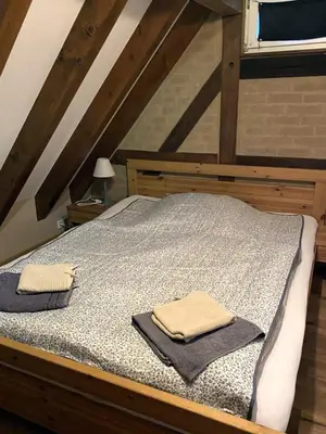 Ein Bett oder Betten in einem Zimmer der Unterkunft Großes Ferienhaus mit Sauna & Garten in St Martin