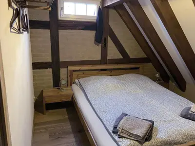 Ein Bett oder Betten in einem Zimmer der Unterkunft Großes Ferienhaus mit Sauna & Garten in St Martin