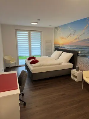 Ein Bett oder Betten in einem Zimmer der Unterkunft Barrierefreie Ferienwohnungen in der Nähe der Golf- und Freizeitanlage