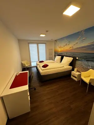 Ein Bett oder Betten in einem Zimmer der Unterkunft Barrierefreie Ferienwohnungen in der Nähe der Golf- und Freizeitanlage