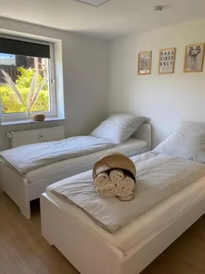 Ein Bett oder Betten in einem Zimmer der Unterkunft Altes Kino XXL - 10 Gäste WiFi Netflix
