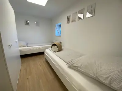 Ein Bett oder Betten in einem Zimmer der Unterkunft Altes Kino XXL - 10 Gäste WiFi Netflix