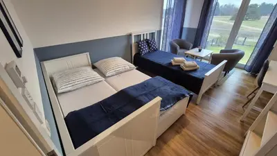 Ein Bett oder Betten in einem Zimmer der Unterkunft Perfekter Rückzugsort - Probewohnen im Musterhaus