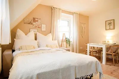 Ein Bett oder Betten in einem Zimmer der Unterkunft BOHO-Apartment - Feel like Home, Tiny Bathroom & Garage, 60m2
