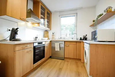 Küche/Küchenzeile in der Unterkunft BOHO-Apartment - Feel like Home, Tiny Bathroom & Garage, 60m2