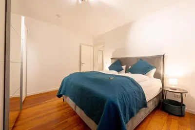 Ein Bett oder Betten in einem Zimmer der Unterkunft LIT LIVING Weinheim Altstadt - Boutique Apartments - Parking