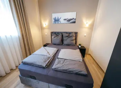 Ein Bett oder Betten in einem Zimmer der Unterkunft Main Boardinghouse