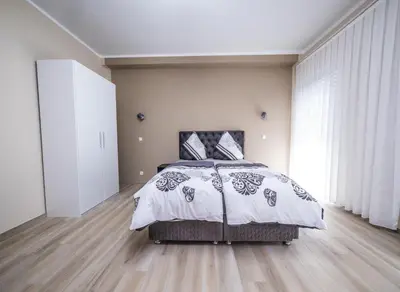 Ein Bett oder Betten in einem Zimmer der Unterkunft Main Boardinghouse