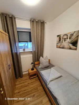 Ein Bett oder Betten in einem Zimmer der Unterkunft Handwerkerwohnung, Monteurunterkunft-Rodgau