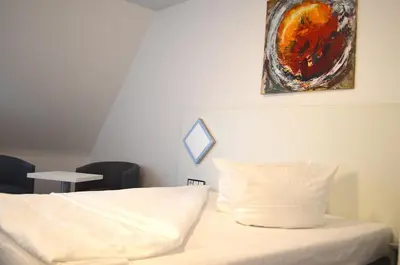 Ein Bett oder Betten in einem Zimmer der Unterkunft Weber Hotel Mannheim