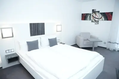 Ein Bett oder Betten in einem Zimmer der Unterkunft Weber Hotel Mannheim