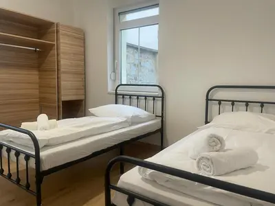Ein Bett oder Betten in einem Zimmer der Unterkunft Timeless: 4 Zimmer Apartment Ludwigsburg