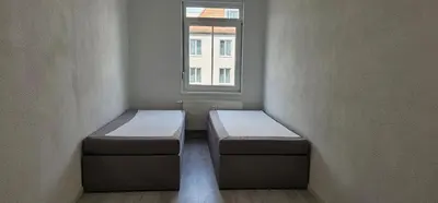 Ein Bett oder Betten in einem Zimmer der Unterkunft Timeless: 4 Zimmer Apartment OG Ludwigsburg