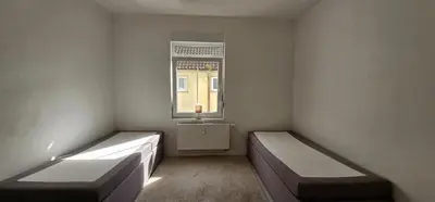 Ein Bett oder Betten in einem Zimmer der Unterkunft Timeless: 4 Zimmer Apartment OG Ludwigsburg