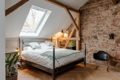 Ein Bett oder Betten in einem Zimmer der Unterkunft Boutique Ferienwohnung Schwalbenstall Uissigheim