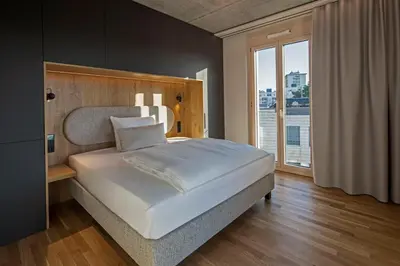Ein Bett oder Betten in einem Zimmer der Unterkunft B5 Apartments