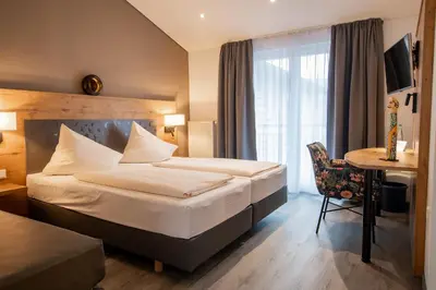 Ein Bett oder Betten in einem Zimmer der Unterkunft Hotel & Restaurant Bestenheider Stuben
