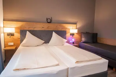 Ein Bett oder Betten in einem Zimmer der Unterkunft Hotel & Restaurant Bestenheider Stuben