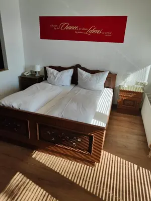 Ein Bett oder Betten in einem Zimmer der Unterkunft Landhotel Neding