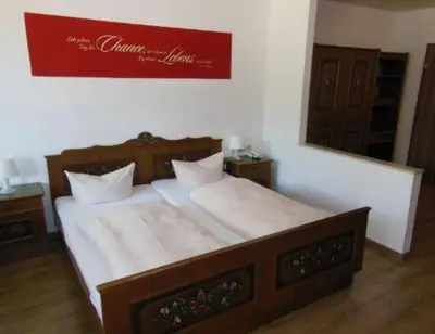 Ein Bett oder Betten in einem Zimmer der Unterkunft Landhotel Neding
