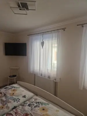 Ein Bett oder Betten in einem Zimmer der Unterkunft Ferienwohnung im Weingut Krämerhof
