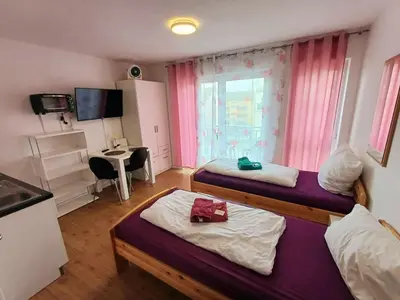 Ein Bett oder Betten in einem Zimmer der Unterkunft Apartments-Wohnungen direkt in Aschaffenburg
