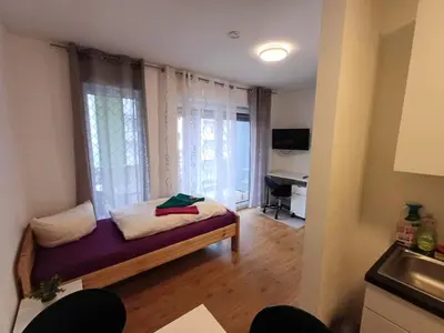 Ein Bett oder Betten in einem Zimmer der Unterkunft Apartments-Wohnungen direkt in Aschaffenburg