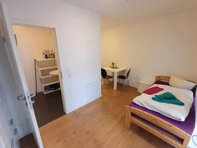 Ein Bett oder Betten in einem Zimmer der Unterkunft Apartments-Wohnungen direkt in Aschaffenburg