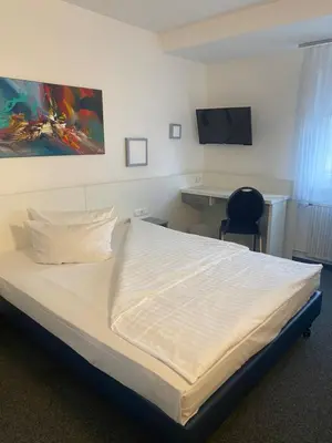 Ein Bett oder Betten in einem Zimmer der Unterkunft Weber Residenz