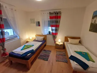 Ein Bett oder Betten in einem Zimmer der Unterkunft APARTMENTS / WOHNUNG IN HAIBACH