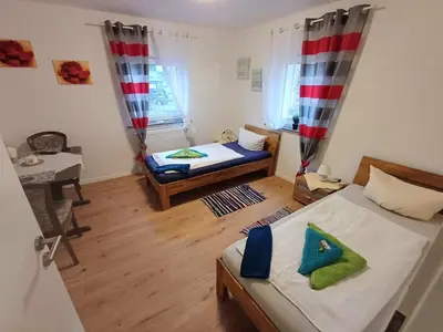 Ein Bett oder Betten in einem Zimmer der Unterkunft APARTMENTS / WOHNUNG IN HAIBACH