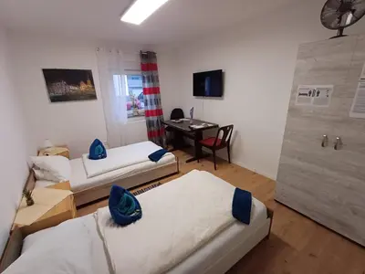 Ein Bett oder Betten in einem Zimmer der Unterkunft APARTMENTS / WOHNUNG IN HAIBACH