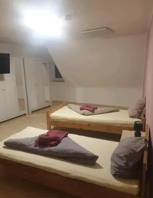 Ein Bett oder Betten in einem Zimmer der Unterkunft APARTMENT / WOHNUNG IN HAIBACH