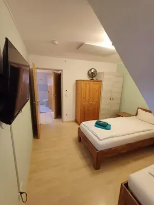 Ein Bett oder Betten in einem Zimmer der Unterkunft APARTMENT / WOHNUNG IN HAIBACH