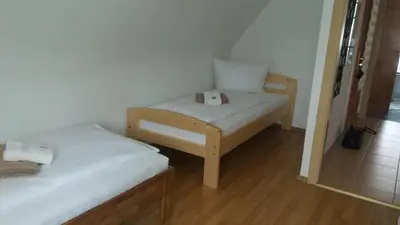 Ein Bett oder Betten in einem Zimmer der Unterkunft APARTMENTS / WOHNUNG IN HAIBACH