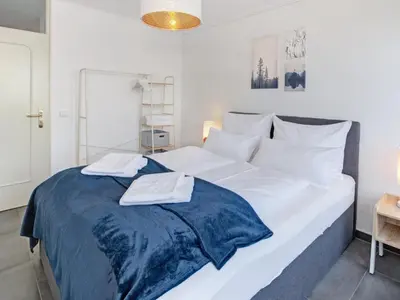 Ein Bett oder Betten in einem Zimmer der Unterkunft Das Penthouse - Jacuzzi - BBQ - Dachterrasse