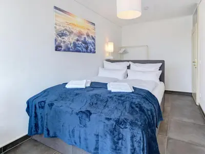Ein Bett oder Betten in einem Zimmer der Unterkunft Das Penthouse - Jacuzzi - BBQ - Dachterrasse