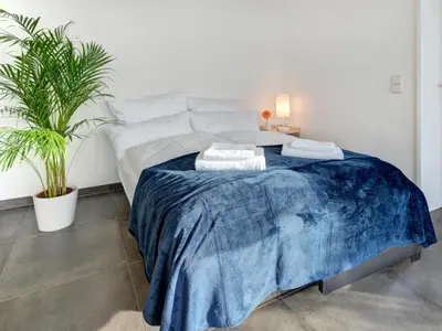 Ein Bett oder Betten in einem Zimmer der Unterkunft Das Penthouse - Jacuzzi - BBQ - Dachterrasse