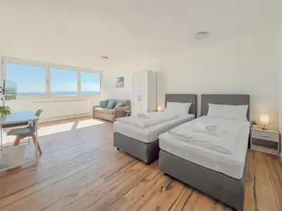 Ein Bett oder Betten in einem Zimmer der Unterkunft Rosenberg-Suites - Parkplatz, Zentral, Business & Privat