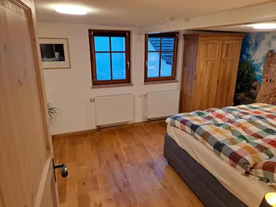 Ein Bett oder Betten in einem Zimmer der Unterkunft Gästehaus Merlin mit Saunabereich