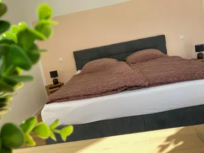 Ein Bett oder Betten in einem Zimmer der Unterkunft Ferienwohnung im Weingut Jens Griebel