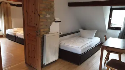 Ein Bett oder Betten in einem Zimmer der Unterkunft Gästehaus Zu Herrenwiesen