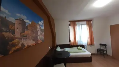 Ein Bett oder Betten in einem Zimmer der Unterkunft Gästehaus Zu Herrenwiesen