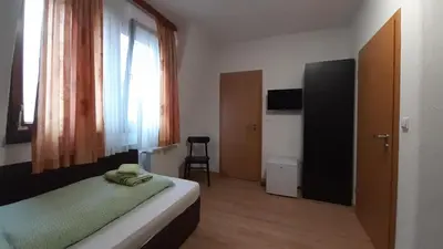 Ein Bett oder Betten in einem Zimmer der Unterkunft Gästehaus Zu Herrenwiesen