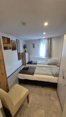 Ein Bett oder Betten in einem Zimmer der Unterkunft Volkspark-3-Zimmer-Wohnung-4 Betten-Mainz