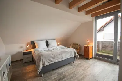Ein Bett oder Betten in einem Zimmer der Unterkunft Odenwaldblick