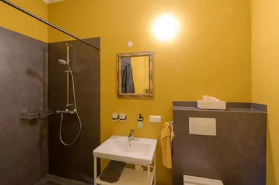 Ein Badezimmer in der Unterkunft Gästehaus Villa Fliedner - Das Kutscherhaus