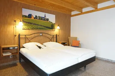 Ein Bett oder Betten in einem Zimmer der Unterkunft Weingut & Gästehaus Julianenhof