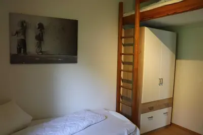 Ein Bett oder Betten in einem Zimmer der Unterkunft Ferienhaus Robinson Am Krappennest 92